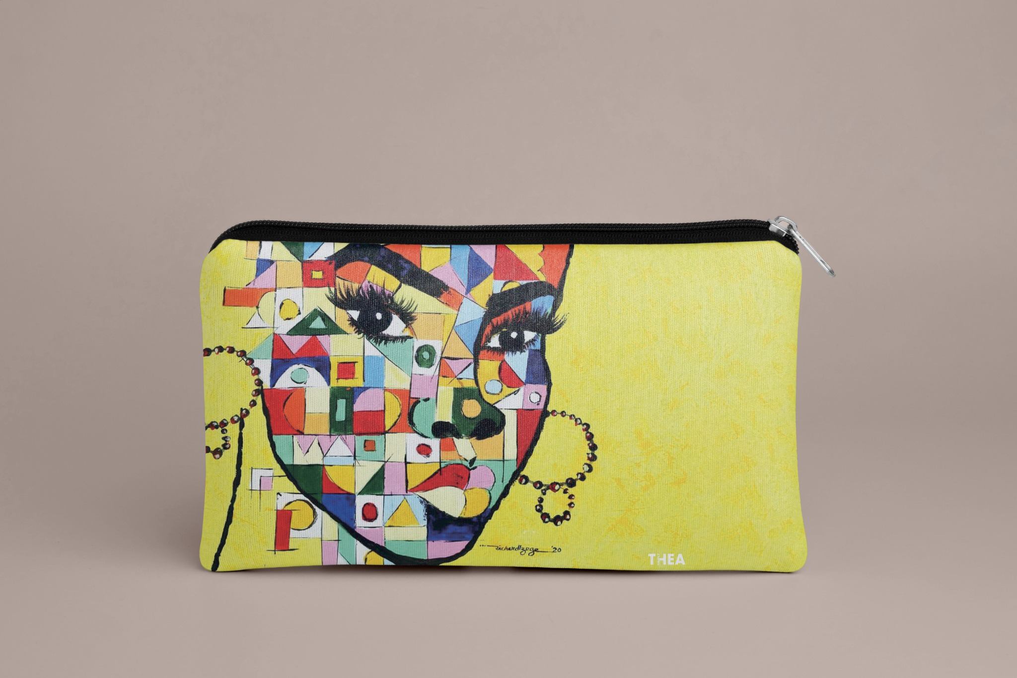 Simply Thea pouch mockup with colourful portrait artwork and a small wordmark